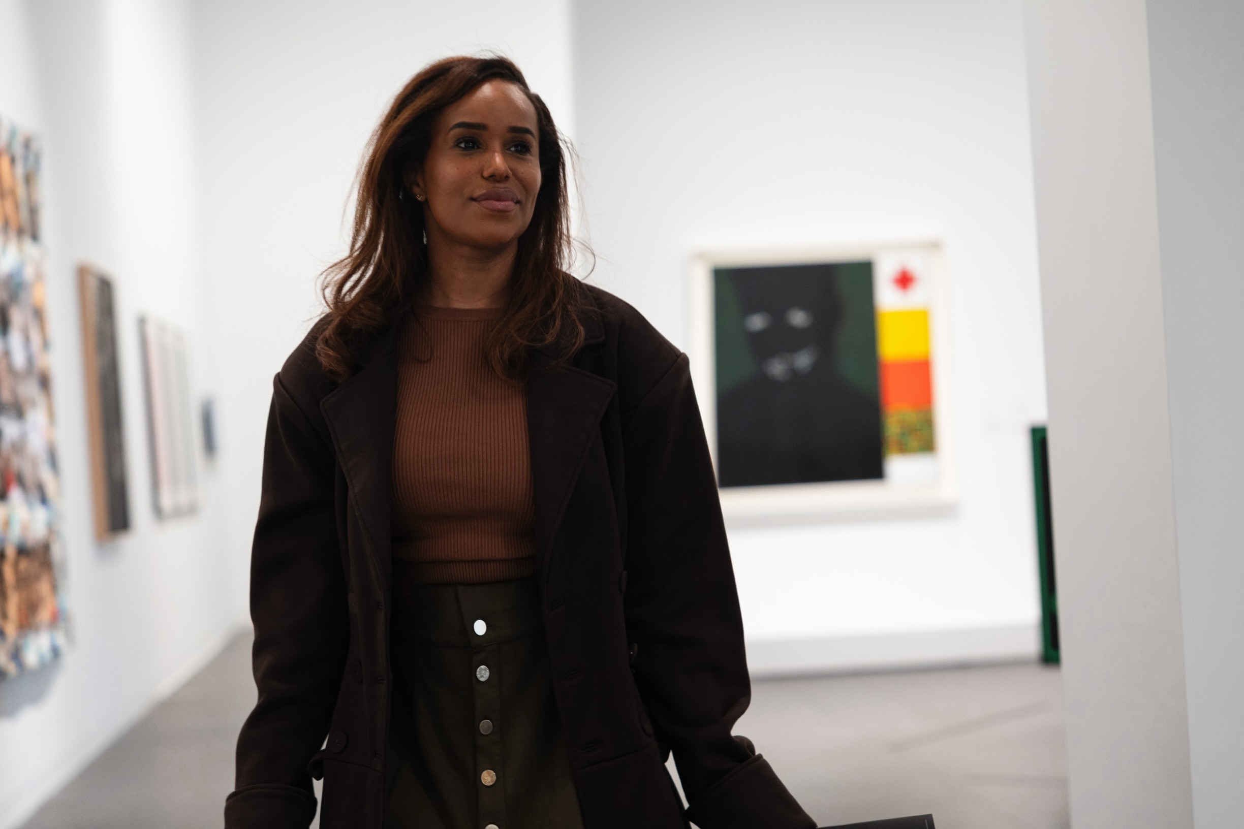 Eva walking through an art gallery